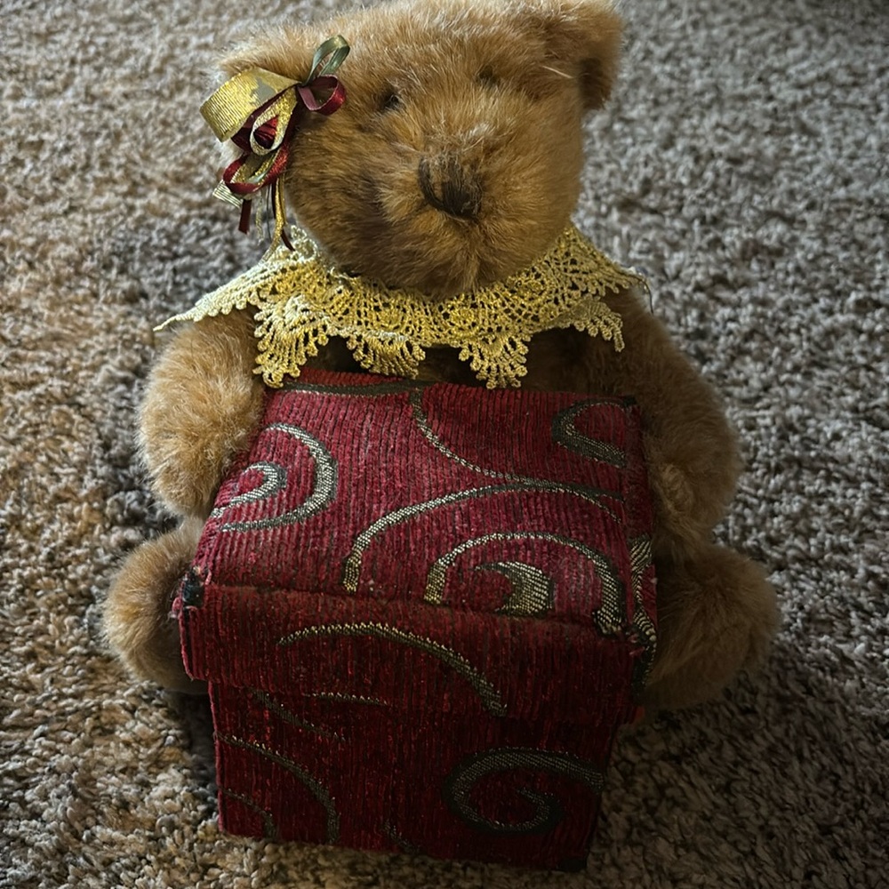 Brown bear with red swirled corduroy box that opens to store things.by dandee